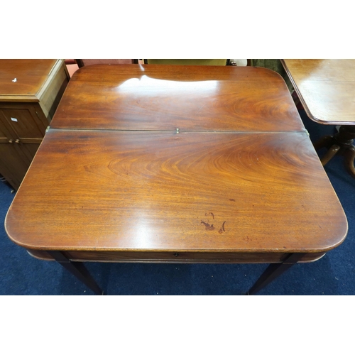 23 - A 19th century mahogany fold-over tea table with single drawer on square tapering supports, 75cm hig... 