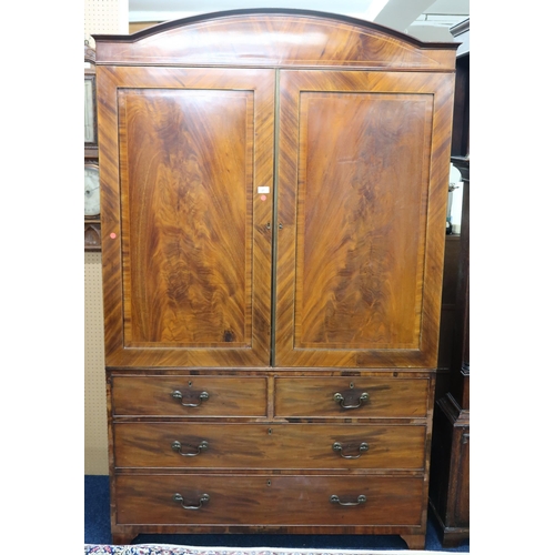 27 - A 19th century mahogany veneered linen press wardrobe with pair of panel doors over two short over o... 