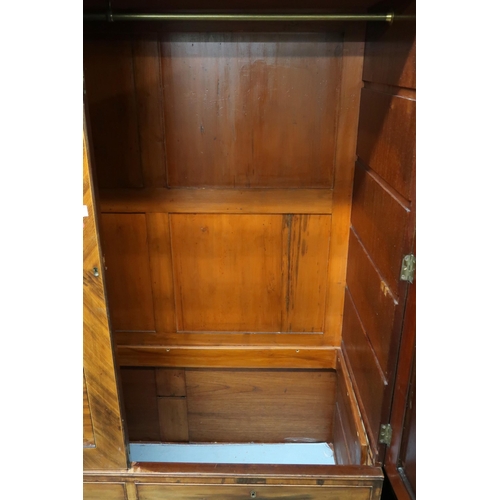 27 - A 19th century mahogany veneered linen press wardrobe with pair of panel doors over two short over o... 