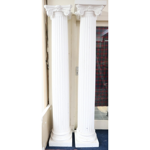 36 - A pair of large faux marble Greek Ionic style columns, 212cm high (2)