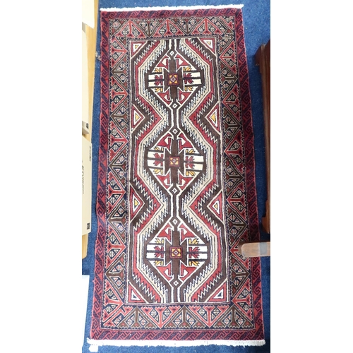 50 - A multicoloured ground fine handwoven Persian Baluchi nomadic rug with geometric patterned ground wi... 