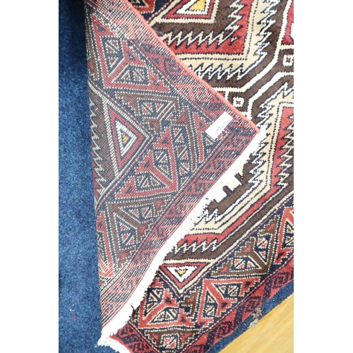 50 - A multicoloured ground fine handwoven Persian Baluchi nomadic rug with geometric patterned ground wi... 