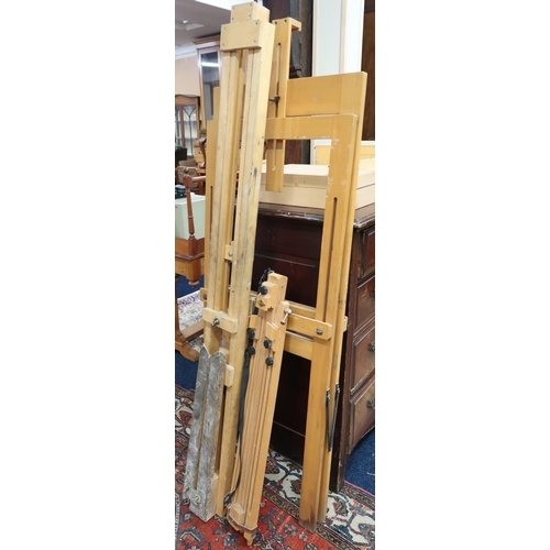 51 - A lot of three assorted pine folding easels and three assorted paints boxes (6)