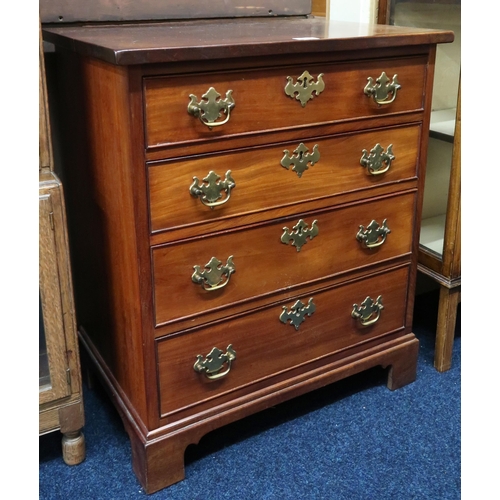 54 - A 20th century mahogany reproduction chest with four graduating drawers with brass fittings on brack... 