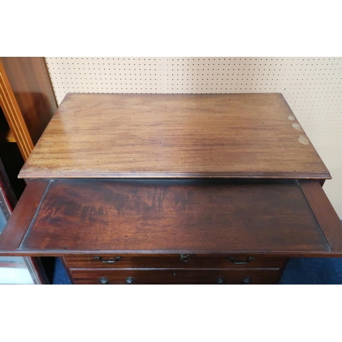 59 - A 19th century mahogany chest of drawers with pull out writing slide over four graduating drawers on... 