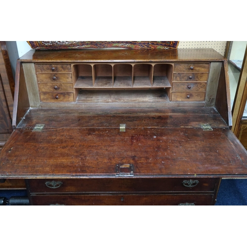 6 - A large Georgian mahogany fall front writing bureau with fitted writing compartment over four drawer... 