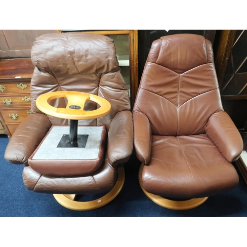 62 - A lot of two assorted Stressless style reclining armchairs and an associated footstool (3)