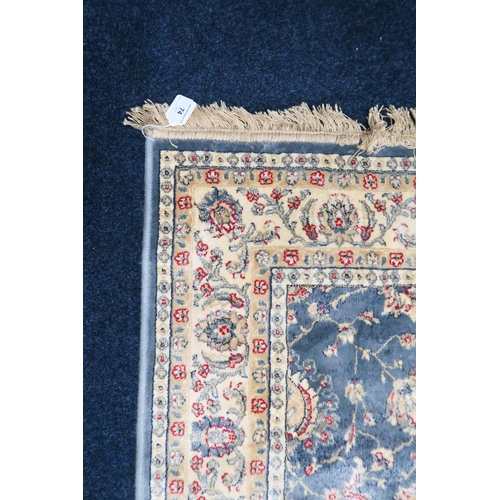 74 - A duck egg blue full pile kashmir Zeigler rug with all over floral patterned design within ivory flo... 