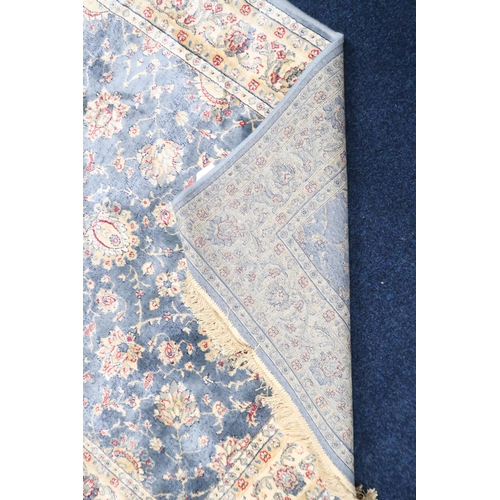 74 - A duck egg blue full pile kashmir Zeigler rug with all over floral patterned design within ivory flo... 