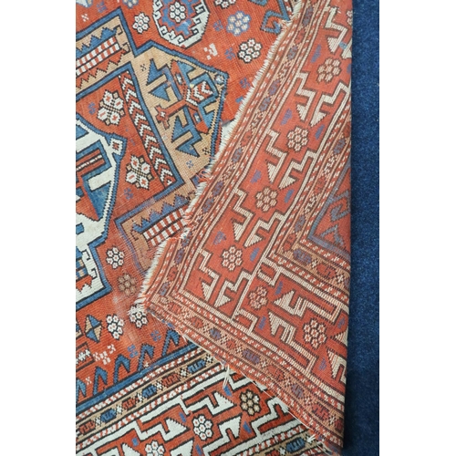 78 - A lot to include a terracotta ground Hamadan rug with multicoloured geometric central medallion and ... 