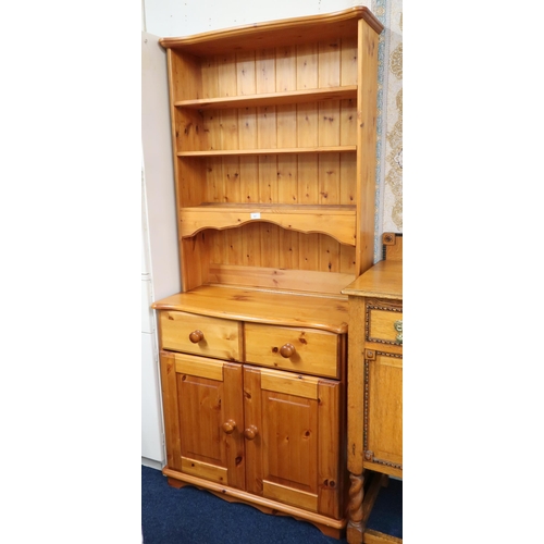 87 - A 20th century pine kitchen dresser with three tiered open shelves on base with two drawers over pai... 