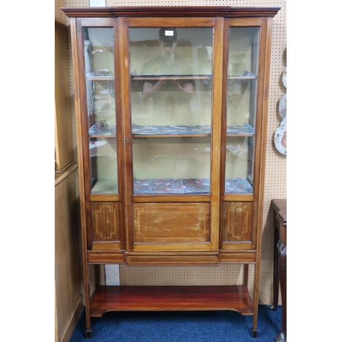 9 - An Edwardian mahogany breakfront glazed display cabinet with single central door flanked by glazed s... 