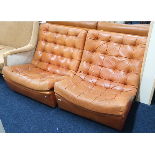 97 - A pair of mid 20th century brown leather button upholstered lounge chairs, 75cm high x 79cm wide x 9... 