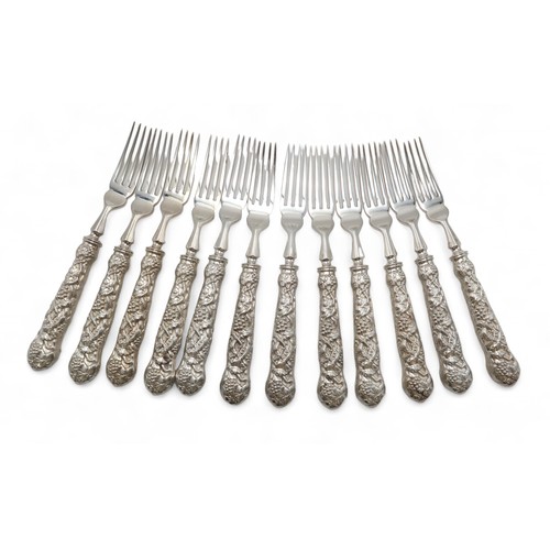 2528 - A CANTEEN OF ELIZABETH II SILVER CUTLERY mainly by Mappin & Webb, London 1979, the grape scissor... 