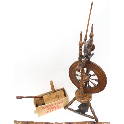 50A - A lot comprising a 19th century oak treadle spinning wheel, associated ephemera and a multicoloured ... 