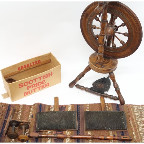 50A - A lot comprising a 19th century oak treadle spinning wheel, associated ephemera and a multicoloured ... 