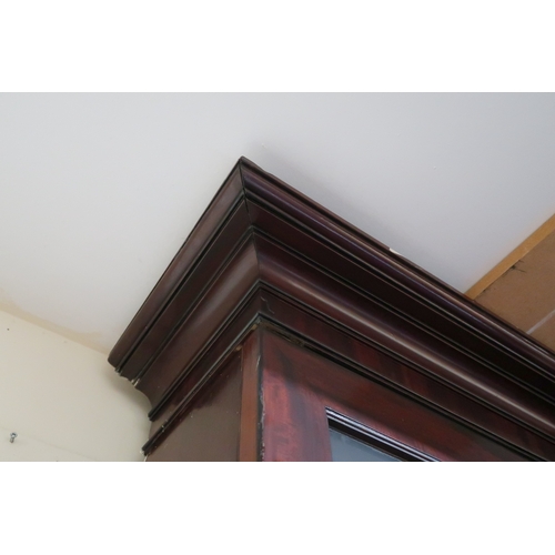 2018 - A LARGE 19TH CENTURY MAHOGANY BREAKFRONT LIBRARY BOOKCASE with stepped moulded cornices over pair of... 