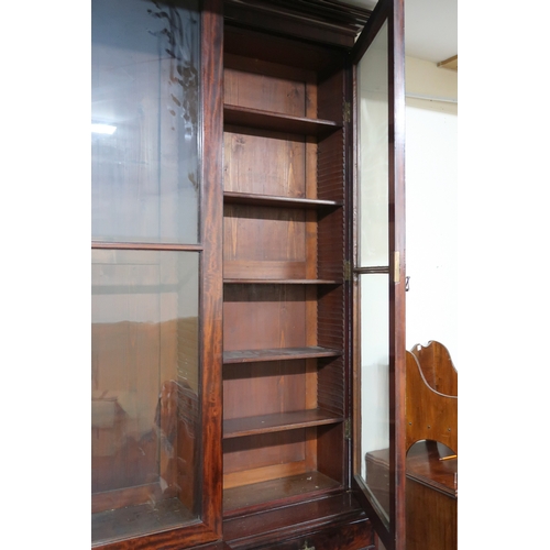 2018 - A LARGE 19TH CENTURY MAHOGANY BREAKFRONT LIBRARY BOOKCASE with stepped moulded cornices over pair of... 