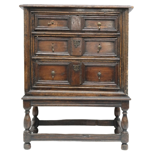 2019 - A 17TH CENTURY OAK JACOBEAN CHEST ON STAND with three graduating drawers on base with turned support... 