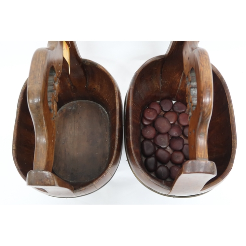 2021 - A PAIR OF 20TH CENTURY CHINESE HARDWOOD WATER CARRIERS with carved pierced carry handles over cooper... 