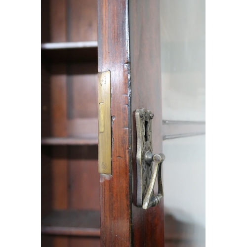 2018 - A LARGE 19TH CENTURY MAHOGANY BREAKFRONT LIBRARY BOOKCASE with stepped moulded cornices over pair of... 