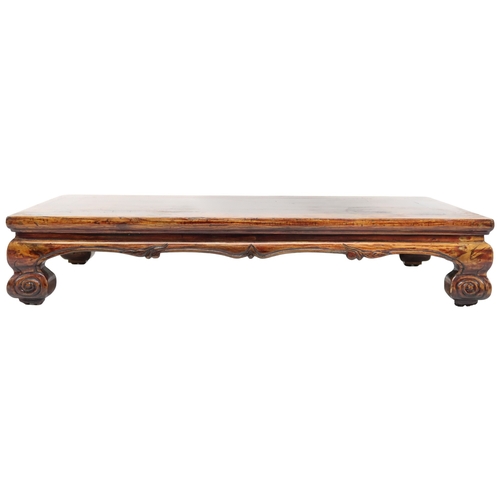 2025 - A 20TH CENTURY CHINESE HARDWOOD LOW OPIUM TABLE converted from a cabinet base with rectangular top o... 