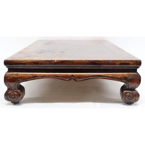 2025 - A 20TH CENTURY CHINESE HARDWOOD LOW OPIUM TABLE converted from a cabinet base with rectangular top o... 