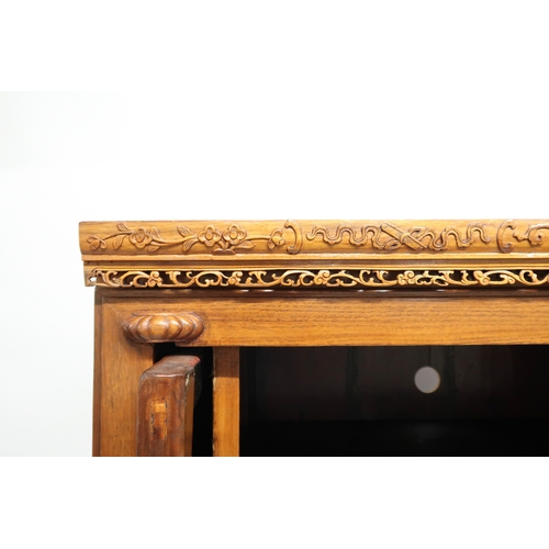 2027 - A 20TH CENTURY CHINESE HARDWOOD WEDDING CABINET with carved pierced frieze over pair of cabinet door... 