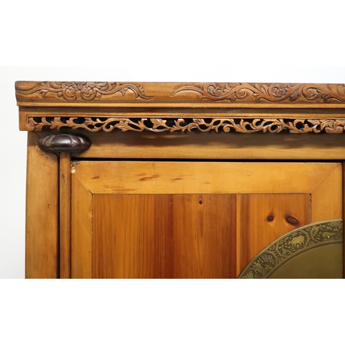 2028 - A 20TH CENTURY CHINESE HARDWOOD WEDDING CABINET with carved pierced frieze over pair of doors mounte... 