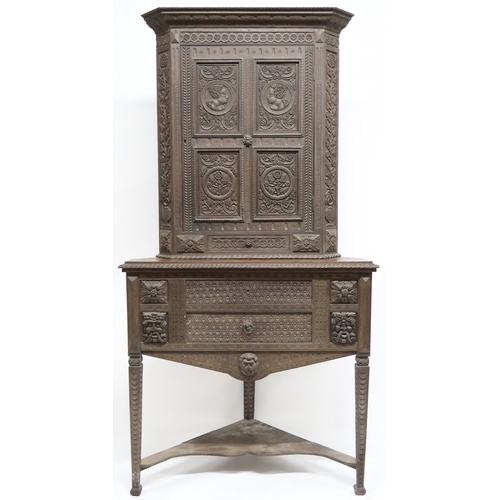 2032 - A LARGE 17TH CENTURY STYLE OAK CORNER CABINET ON STAND with gadrooned moulded cornice over single ca... 