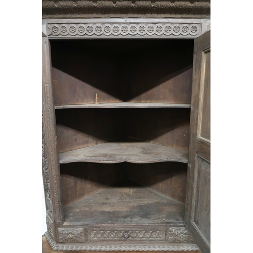 2032 - A LARGE 17TH CENTURY STYLE OAK CORNER CABINET ON STAND with gadrooned moulded cornice over single ca... 