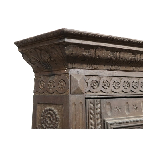 2032 - A LARGE 17TH CENTURY STYLE OAK CORNER CABINET ON STAND with gadrooned moulded cornice over single ca... 