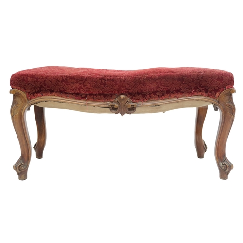 2033 - A LARGE 19TH CENTURY WALNUT FRAMED FOOTSTOOL with red velvet Damask upholstery on carved serpentine ... 