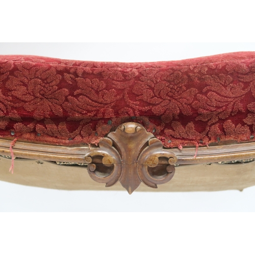 2033 - A LARGE 19TH CENTURY WALNUT FRAMED FOOTSTOOL with red velvet Damask upholstery on carved serpentine ... 