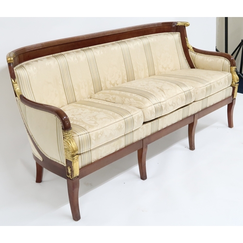 2107 - A CONTEMPORARY LOUIS XVI STYLE THREE SEATER SETTEE with cream Damask upholstery on shaped frame with... 