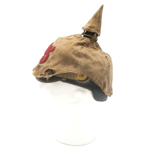 2611 - AN IMPERIAL GERMAN PRUSSIAN OFFICER'S PICKELHAUBEWith scaled chinstrap, the spike having star fittin... 