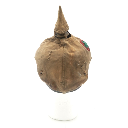 2611 - AN IMPERIAL GERMAN PRUSSIAN OFFICER'S PICKELHAUBEWith scaled chinstrap, the spike having star fittin... 