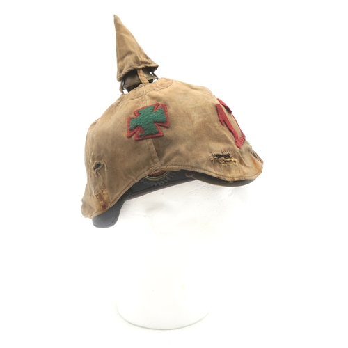 2611 - AN IMPERIAL GERMAN PRUSSIAN OFFICER'S PICKELHAUBEWith scaled chinstrap, the spike having star fittin... 