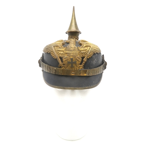 2611 - AN IMPERIAL GERMAN PRUSSIAN OFFICER'S PICKELHAUBEWith scaled chinstrap, the spike having star fittin... 