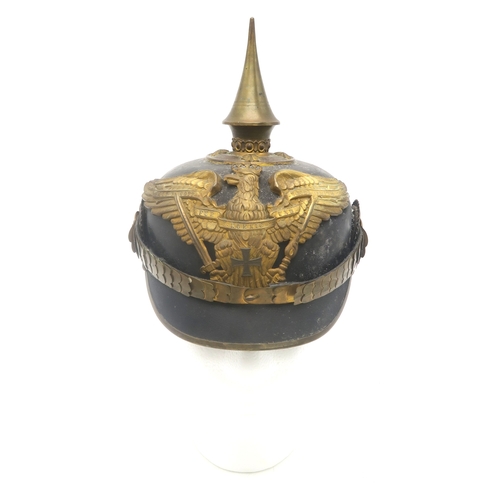 2611 - AN IMPERIAL GERMAN PRUSSIAN OFFICER'S PICKELHAUBEWith scaled chinstrap, the spike having star fittin... 