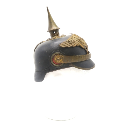 2611 - AN IMPERIAL GERMAN PRUSSIAN OFFICER'S PICKELHAUBEWith scaled chinstrap, the spike having star fittin... 