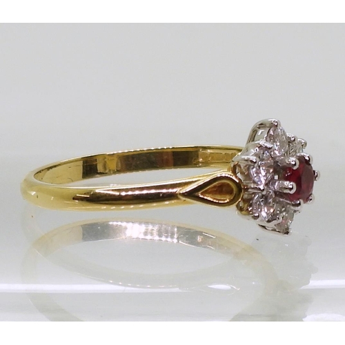 792 - An 18ct ruby and diamond flower ring, set with estimated approx 0.30cts of brilliant cut diamonds, f... 