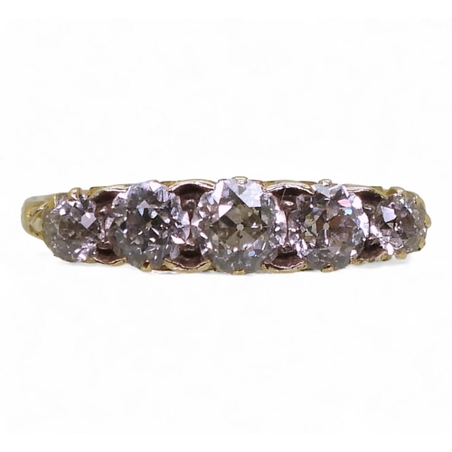 837 - A bright yellow metal scrolled mount ring set with five old cut diamonds, with an estimated approx d... 