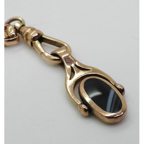 703 - A 9ct gold guard chain with 9ct gold mother of pearl and onyx swivel fob, hallmarked 9ctto the clasp... 