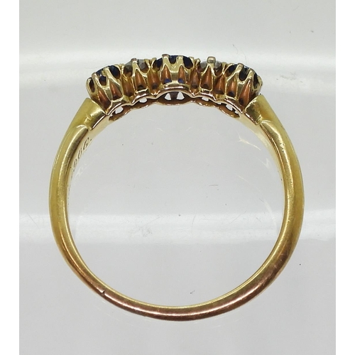 707 - A yellow metal sapphire and diamond ring, the shank stamped '18' with inscription dated 1906, size O... 