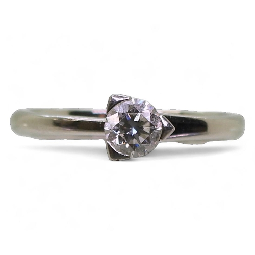 709 - A platinum diamond solitaire, set with with an estimated approx 0.20cts, size N1/2, weight 4.6gms