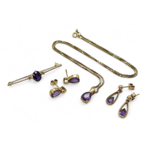 711 - A collection of 9ct gold amethyst jewellery to include a brooch,  two pairs of earrings  a... 