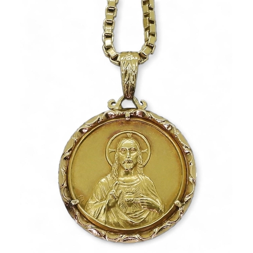 712 - An 18ct 50cm gold box chain with a bright yellow metal holy medal pendant, weight together 20.5gms