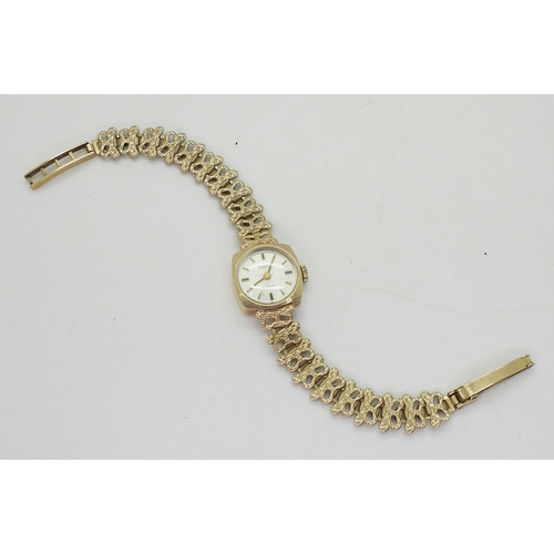 731 - A 9ct gold Roamer ladies watch and strap, weight including mechanism 11.4gms