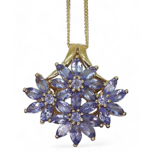 733 - A 9ct gold blue gem flower pendant and 45cm chain, 3.4gms